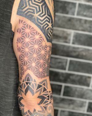 Geometric tattoo on upper arm