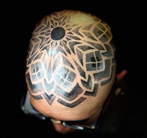 Geometric tattoo on head