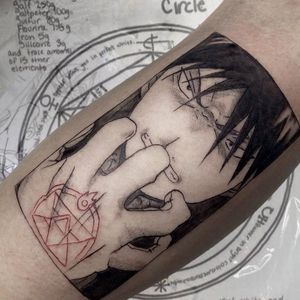 Get a bold blackwork tattoo of a boy on your arm by the talented artist Greed. Perfect for those who love illustrative tattoos.