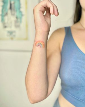 Experience a burst of color with this illustrative rainbow tattoo by Silber/Sofie. Perfect for showcasing your love for vibrant hues.