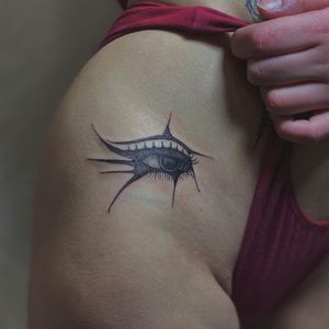 Stunning blackwork eye tattoo on upper leg by talented artist Amour.x, a unique and striking addition to your body art collection.