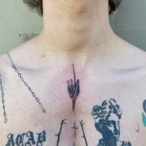 Illustrative fork tattoo by Amour.x, beautifully placed on the sternum for a unique touch of love and creativity.