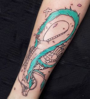 Experience the power of dragons with this stunning illustrative forearm tattoo by Greed. Bold lines and vibrant colors bring this mythological creature to life.