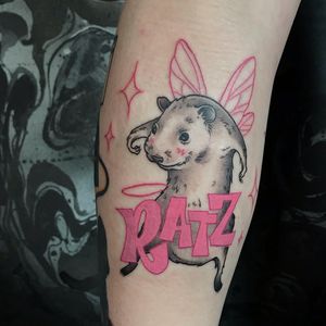 Unique lower leg tattoo featuring wings, rat, and inspirational quote by artist Emiliia Kuzmina.