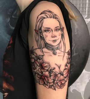 A beautiful tattoo by Emiliia Kuzmina featuring a flower, girl, elf, necklace, and earrings. Perfect for upper arm placement.