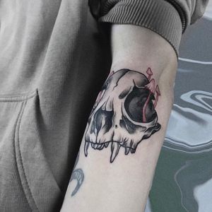 Emiliia Kuzmina's blackwork illustration featuring a skull and mushroom on the forearm.