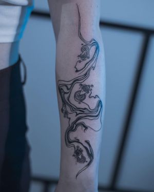 Get a stunning blackwork illustrative pattern tattoo on your forearm by Greed for a unique and bold look.