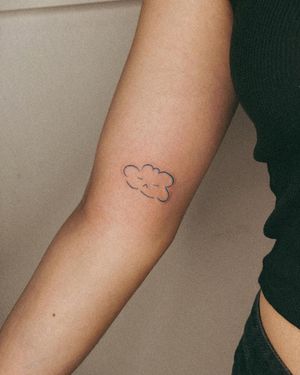 Elegant illustrative tattoo of a cloud by the talented artist Silber/Sofie, perfect for your upper arm. Embrace the beauty of minimalistic design.