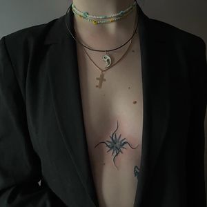 Get a stunning star pattern sternum tattoo designed by Amour.x, perfect for lovers of unique illustrative ink!