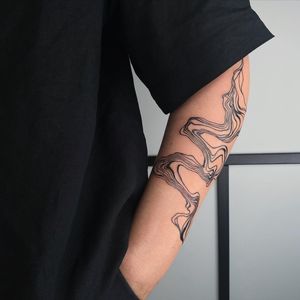 Show off your style with an illustrative blackwork pattern tattooed on your forearm by the talented artist Greed.