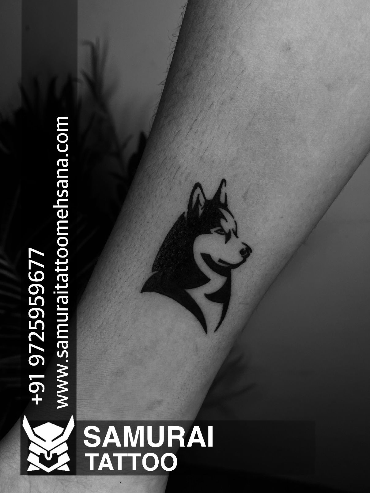 Husky portrait tattoo located on the inner forearm,