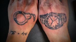 Handcuff and time piece by Victor Francis at Anonymous Ink, Washington PA.