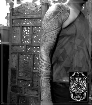 Customs Freehand Full Arm Polynesian Tattoo for Thiruthurairajah Took 5 sessions in a couple weeks only to finish this full arm Polynesian tattoo on Thiru, done at @kayon_tattoo_atelier It was exhausting but also so fun... Thank you for the trust and sitting like a rock bro.... Can't wait to continue the project again next year.. . . . . #lineworktattoo #neopolynesiantattoo #maoritattoo #maori #hendjerin #polynesiantattoo #kayontattooatelier #marquesantattoo #tattoo #blackwork #blackworknow