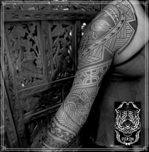 Customs Freehand Full Arm Polynesian Tattoo for Thiruthurairajah Took 5 sessions in a couple weeks only to finish this full arm Polynesian tattoo on Thiru, done at @kayon_tattoo_atelier It was exhausting but also so fun... Thank you for the trust and sitting like a rock bro.... Can't wait to continue the project again next year.. . . . . #lineworktattoo #neopolynesiantattoo #maoritattoo #maori #hendjerin #polynesiantattoo #kayontattooatelier #marquesantattoo #tattoo #blackwork #blackworknow
