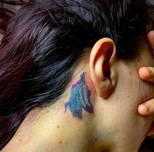Feathers colors tattoo Back of the ear #feathertattoo #featherink 