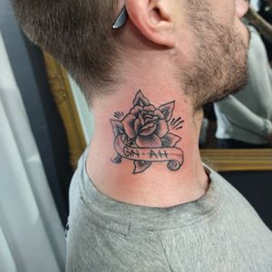Rose with both my daughters initials in the banner. Done at a tattoo charity event.