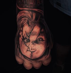 Chucky hand tattoo 