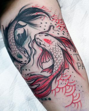 Experience the mystique of the deep sea with this striking blackwork fish tattoo on your upper arm, expertly done by Joza.