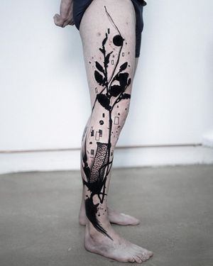 Stunning blackwork upper leg tattoo featuring an illustrative flower pattern design by Joza. A bold and beautiful choice for body art enthusiasts.