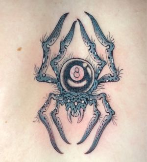 Captivating Japanese style spider tattoo on the back by artist Matthew Ono, embodying mystery and strength.