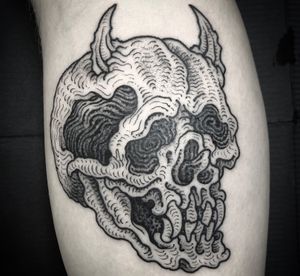 Get a fierce and intricate black and gray Japanese tattoo of a devil skull with horns by renowned artist Matthew Ono.
