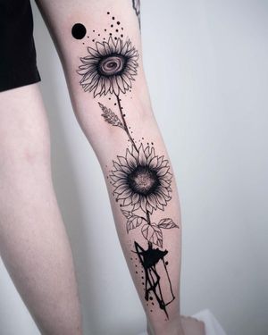 Beautiful blackwork sunflower and pattern tattoo on upper leg by Joza. A unique and illustrative design.
