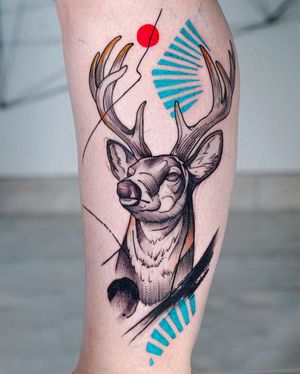 Get a striking deer tattoo on your lower leg by the talented artist Joza. The unique blackwork style and intricate horn pattern make this design stand out.