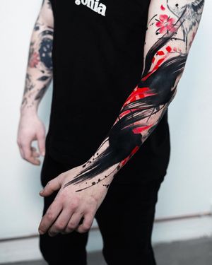 Unique arm tattoo by Joza combining blackwork, illustrative style with watercolor techniques. Features a beautiful flower motif and intricate pattern design.