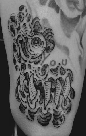 Unique black and gray tattoo featuring a skull and eye design on the upper leg, expertly done by Matthew Ono.