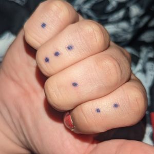 Numbered dots, 1312 from left to right. Purple. My fourth self done stick n poke. 