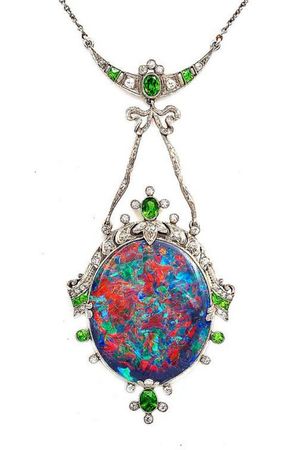 Hoping to get an image of this pendant tattooed on my chest w the top emerald anchored between my collar bones (to look like a dermal) and hopefully about 3" long. Looking for recomendations!