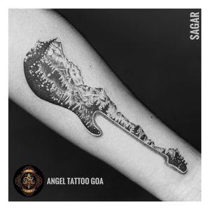 Guitar Tattoo By Sagar Dharoliya At Angel Tattoo Goa - Best Tattoo Artist in Goa - Best Tattoo Studio In Baga Goa - Best Tattoo Shop in Goa - Best Tattoo Studio in Goa - Best Tattoo Artist in Baga Goa