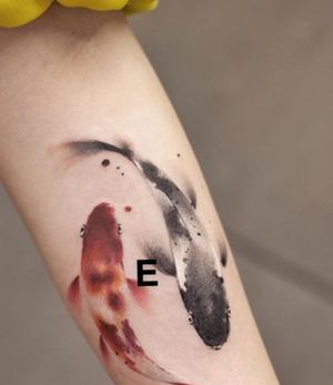 I’m looking for someone who can do this tattoo at a decent price. Something similar to the koi pictured, with an “E” in the middle to represent my daughters name