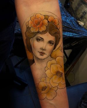 Adorn your forearm with a striking neo-traditional tattoo featuring a beautiful flower and woman design by Edyta.
