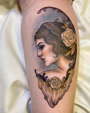 Get a stunning neo traditional tattoo of a woman surrounded by intricate filigree on your lower leg by the talented artist Edyta.