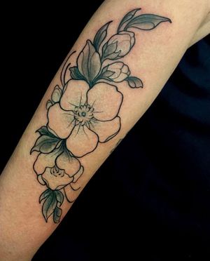 Adorn your forearm with a stunning neo-traditional floral design by talented artist Edyta. Embrace the beauty of nature with this intricate and colorful flower motif.