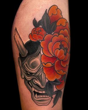 Edyta's unique design combines traditional Japanese hannya mask with vibrant flowers on upper leg.