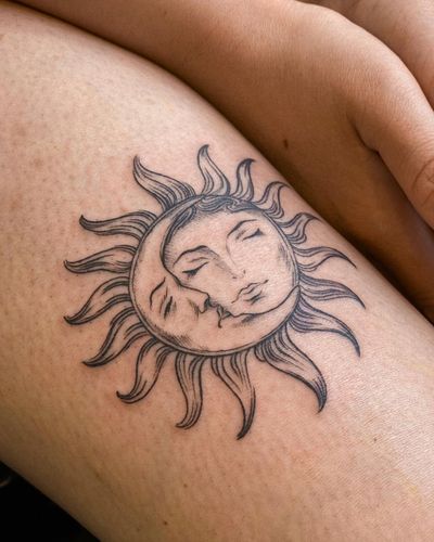 Elegant fine line tattoo featuring a sun and moon motif on the arm, expertly crafted by Edyta.