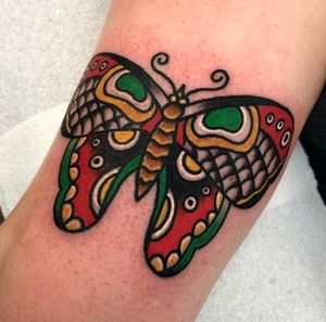 Get inked with a classic butterfly design by renowned artist Alessandro Lanzafame. Elevate your style with this timeless piece of body art.