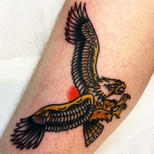 Get a stunning traditional eagle tattoo on your arm by the talented artist Alessandro Lanzafame.