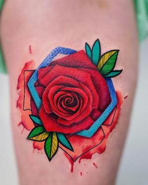 Experience the beauty of realism and watercolor in this stunning flower tattoo on your upper leg. Created by the talented artist, Daniel Verdysh.