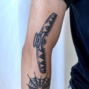 An edgy blackwork tattoo of a trap with spikes, expertly done by Jenna Jeep. Perfect for those who love bold and illustrative designs.