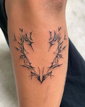 Get a stunning blackwork and illustrative tattoo of a heart and pattern by tattoo artist Holly Hawk on your forearm.