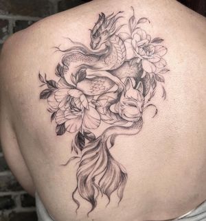 Elegant blackwork design by Palena featuring a dragon, flower, and mask motifs in an illustrative style.