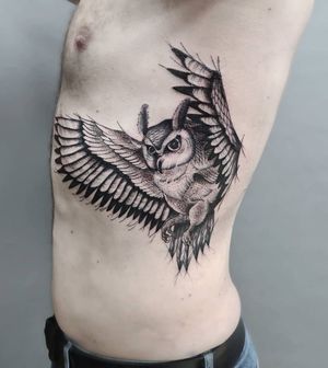 Unique blackwork design by Liza Vettaa. Showcase your love for owls with this intricate rib tattoo.