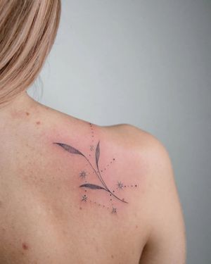 Blackwork and dotwork style leaf tattoo on shoulder by Kateryna Tytarenko. Detailed and striking design.