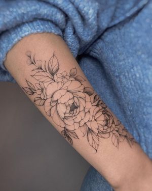 Sophisticated blackwork flower design by Irene Bogachuk, perfect for showcasing on your forearm.