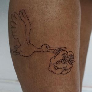 Beautifully detailed tattoo by Nicole Ksiazek featuring a heron, baby, Super Mario, and Luigi on the upper leg.