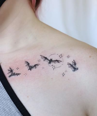 Elegant and detailed bat motif tattoo by talented artist Liza Vettaa, perfect for chest placement.