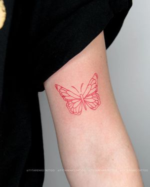 Adorn your upper arm with an illustrative butterfly tattoo by the talented artist Kateryna Tytarenko.